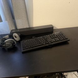 Everything For 130 Desk, speaker, headphones, and keyboard
