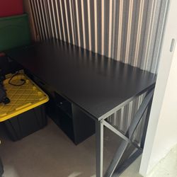 Desk with power outlets and file cabinets