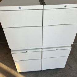 Set Of 4 White Metal Wheeled Filing Cabinets With 3 Drawers Each   Located in concord  Excellent condition  No keys Very heavy   Measures 18” deep; 20