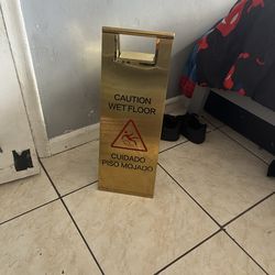 Gold wet floor sign