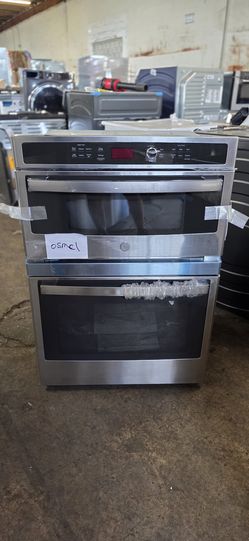 NEW GE 27 INCH MICROWAVE OVEN BUILT IN STAINLESS STEEL