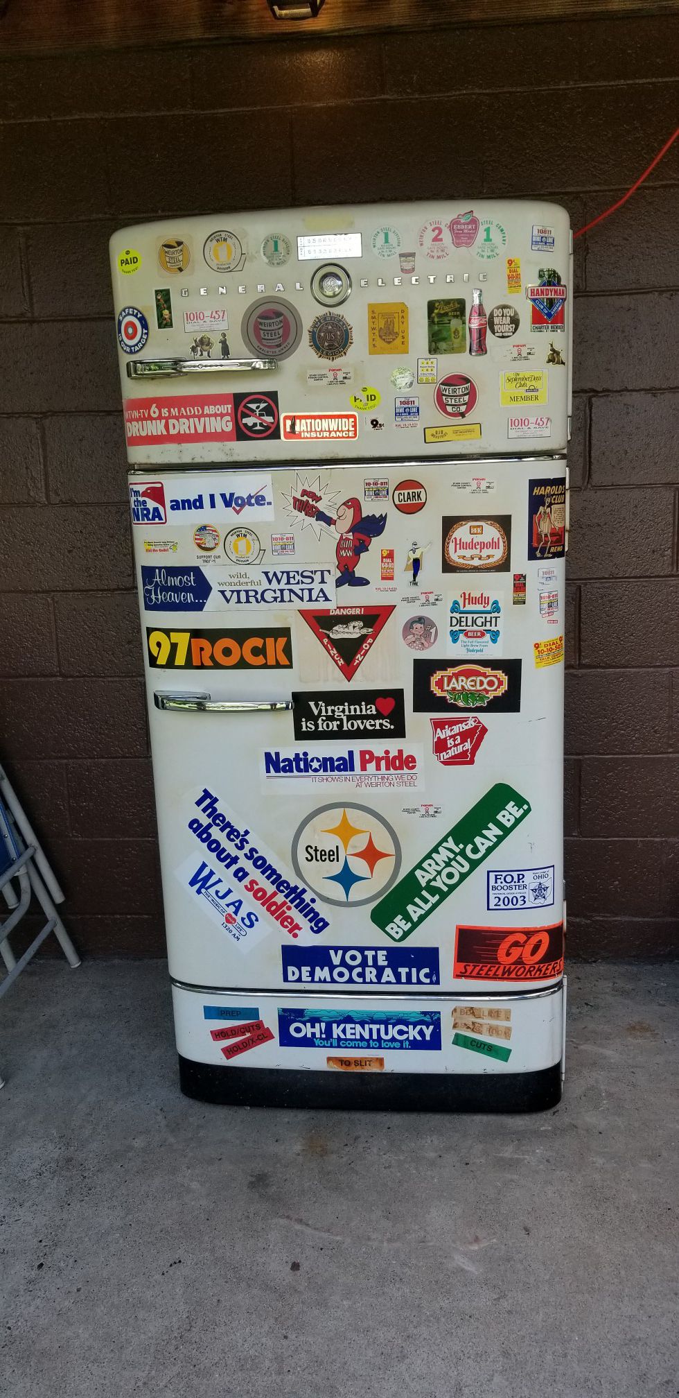 GE refrigerator. Circa 1950's. Still runs good. Would be a good project to refurbish for fans of retro decor.