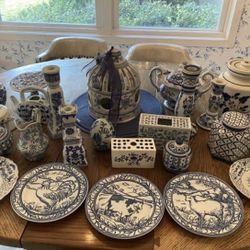 Blue and white plates, pitchers and other decorative pieces