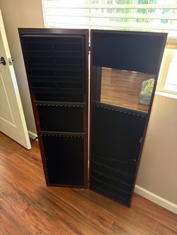 Mirror with jewelry storage
