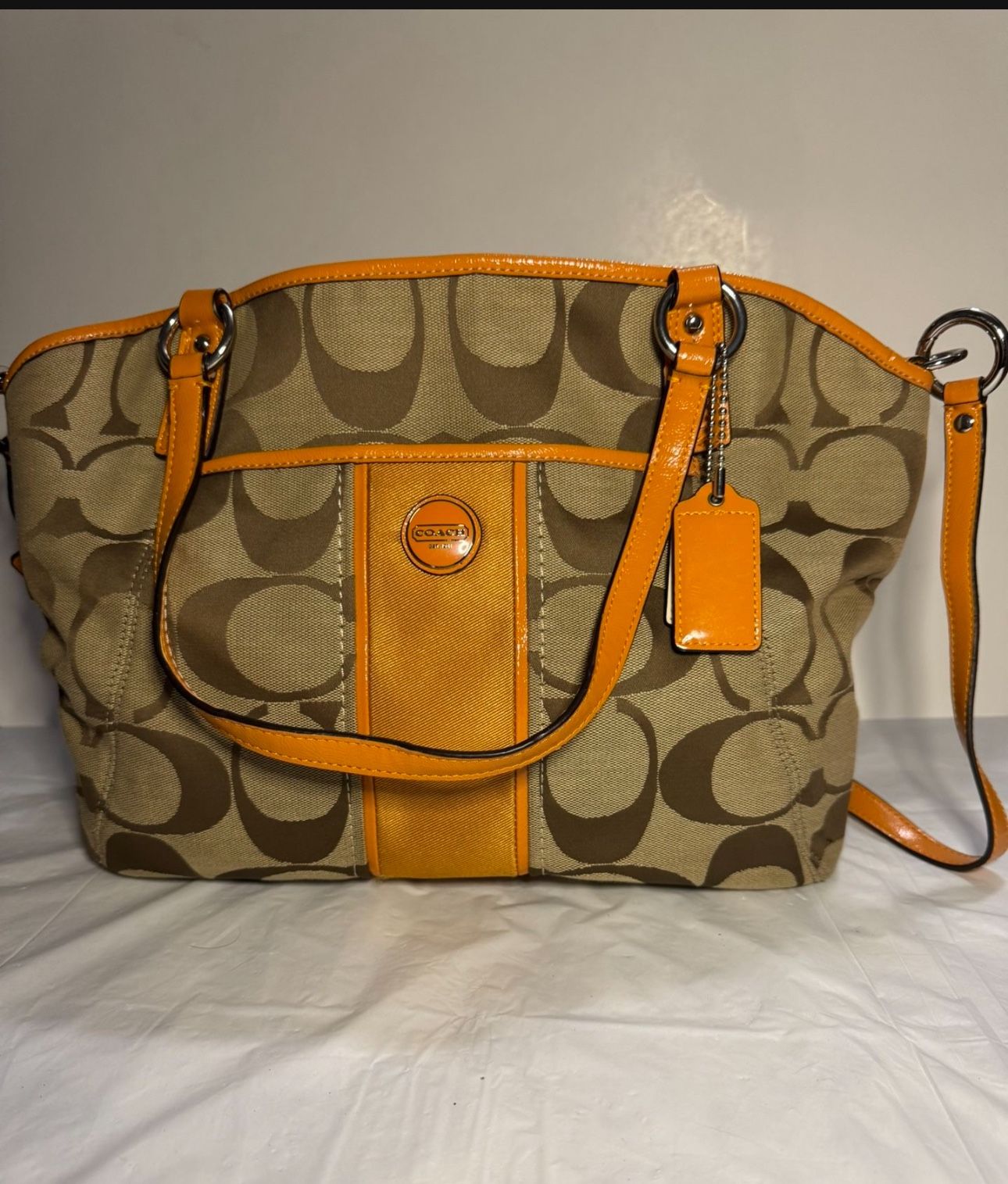 Coach Purse With Pattern In Tan And Brown With Orange Accents