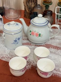 Porcelain Teapot, Canister, and Cups Set