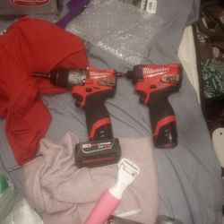 2 Milwaukee Power Tools,1 Is A  Hamer Drill And Driver 2nd Impact Driver