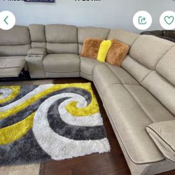 HUGE TAN OR GRAY SECTIONAL WITH 3 RECLINERS. SAME DAY DELIVERY AND EASY FINANCING.