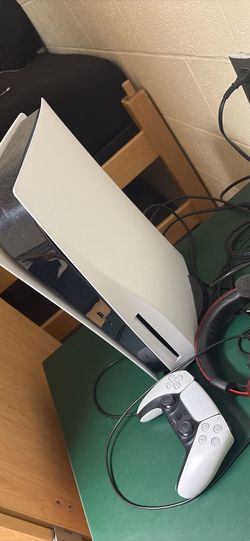 PlayStation 5 with two controllers and headset