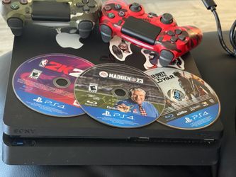PS4 with two controllers and games