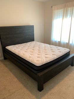 Hybrid by Ashley Queen-size black wood/platform bed frame with a tall headboard