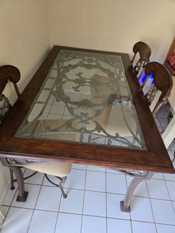 Ornate Metal and Wood Dining Chairs Set 6 chairs.  Glass top