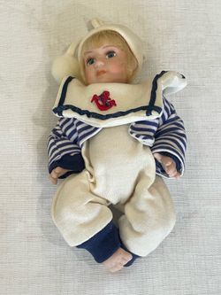 Collectible porcelain sailor doll. 7”