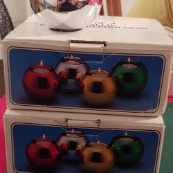 Two Sets Of Four Metallic Ball Candle Holders