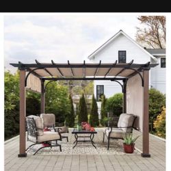 11ft X 11ft Sunjoy Neuralia 11 ft. x 11 ft. Steel Pergola with Natural Wood Looking Finish and Adjustable Tan Shade!!