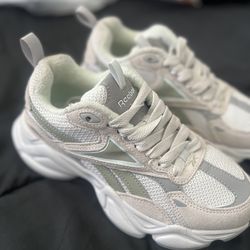 Woman’s Reebok Charge Run Sneakers