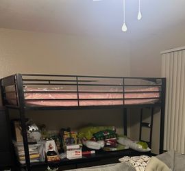 Black bunk bed frame with desk