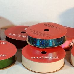 Eight (8) Rolls of Ribbon (Multiple Colors). 2 of the Rolls have 4 different ribbon colors each, plus 6 single color rolls. 340 TOTAL FEET!