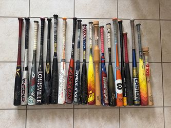 Various baseball bats & trainers