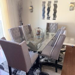 Dining table with six chairs and Rug