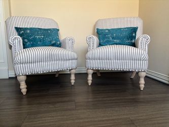A pair of accent chairs