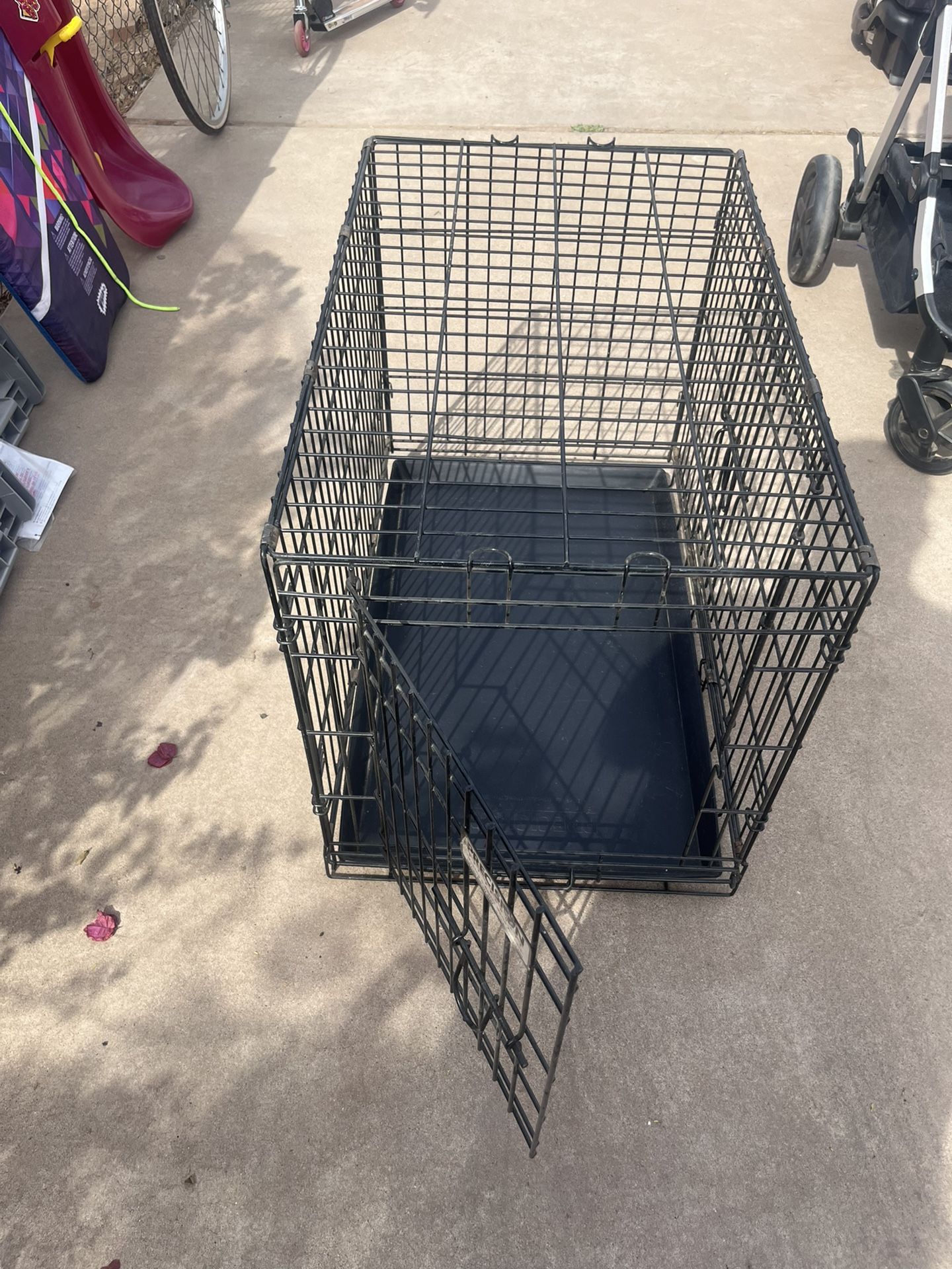 dog Cage 2 doors 30 Inches Long 22 Inches high 19 Inches Width
