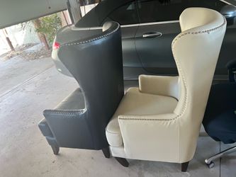 Black and white wingback chairs