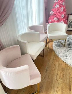 Luxurious plush 4 pink and 2 beige velvet upholstery dining chairs. Rich gold-finished stainless steel base