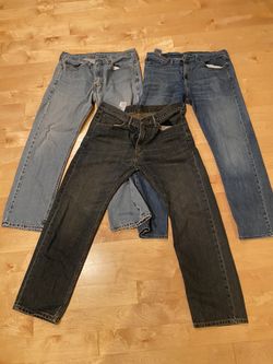 Three pairs of Levi’s pants. Three shades of blue. Size 34/30