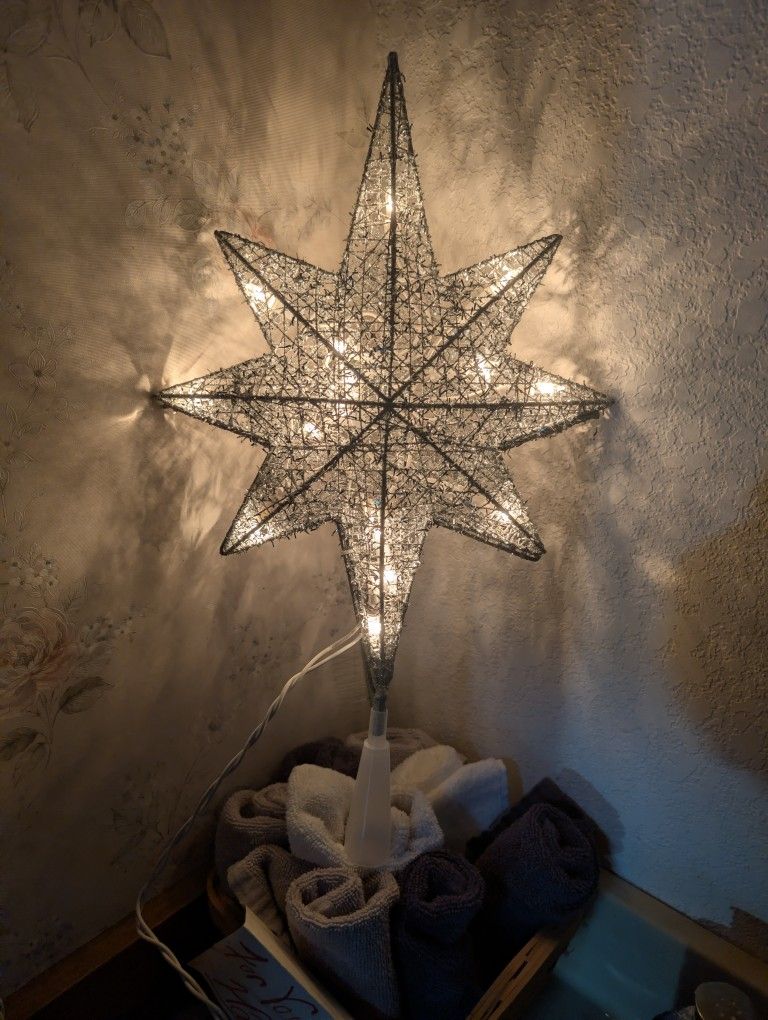 Eight point star, tree topper with white lights