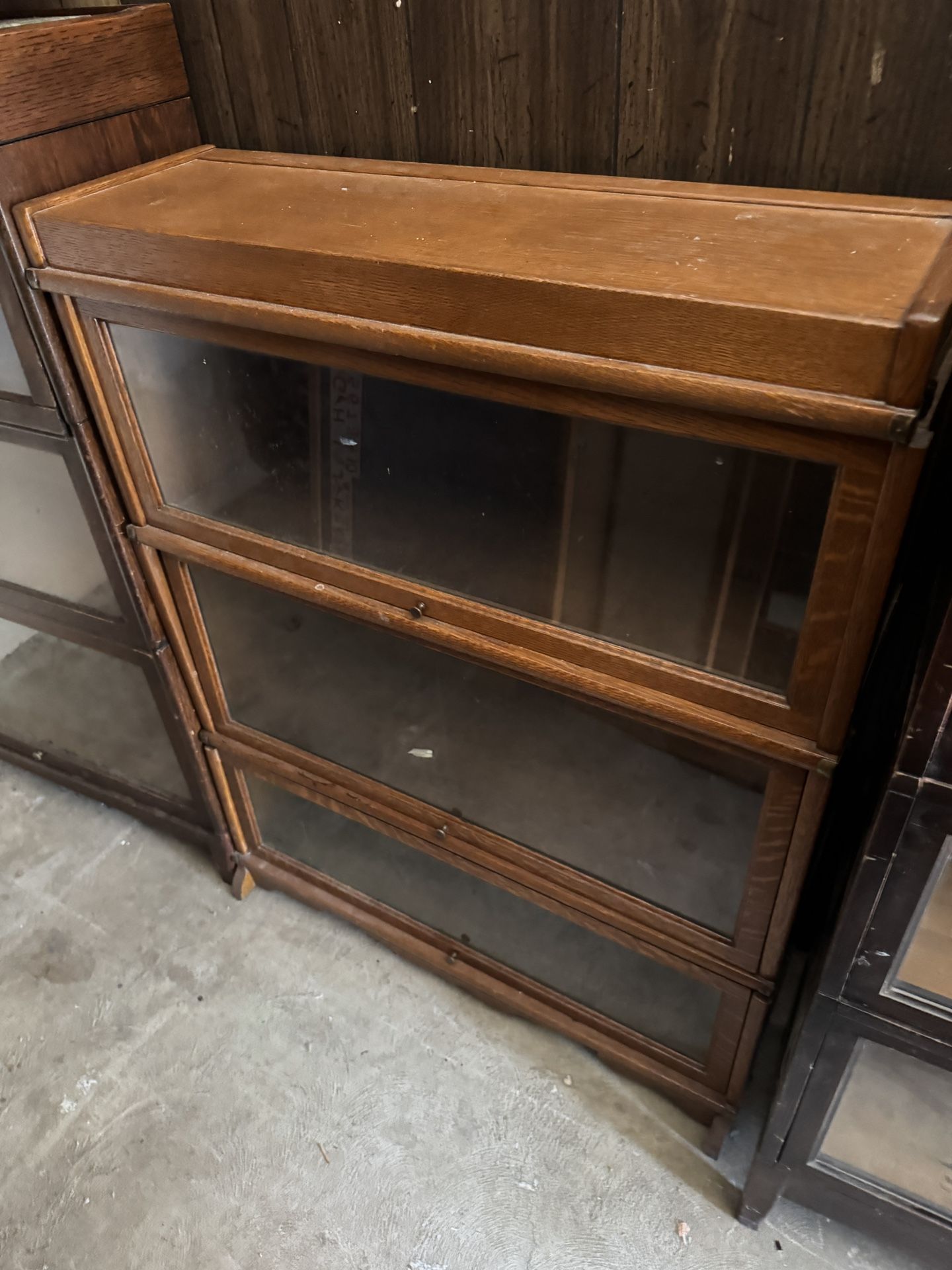 Barrister’s Cabinet Wood Antique Lawyers Bookcase Glass Shelf Macey Sectional Bookcase Size 34” x 11.5” deep by 50 inches tall. Interior of top she