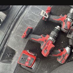 Milwaukee Drills And Impact. Also A Charger Top Off 