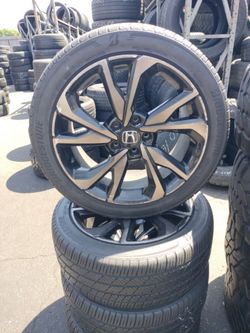 Set of four used tires and wheels 235/45-18