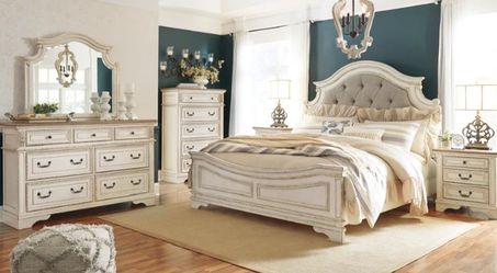 Realyn Chipped White Upholstered Panel Bedroom Set