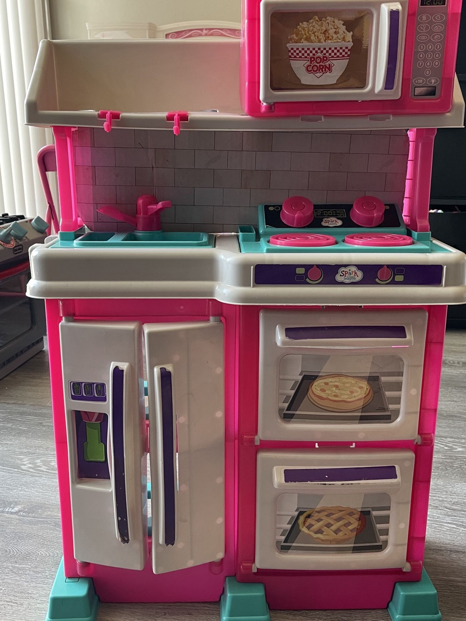 A toddler’s kitchen 2 1/2 feet tall good condition