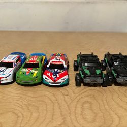 NASCAR cars + Green small trucks