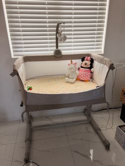 Baby Bassinet with Mobile and Wheels