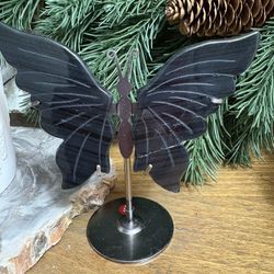 black obsidian crystal butterfly wings on a metal stand. Repaired