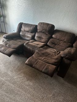 Brown couch with recliner seats
