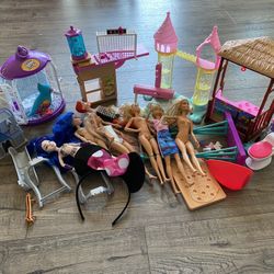 Random Assortment Of Barbie And Other Toys