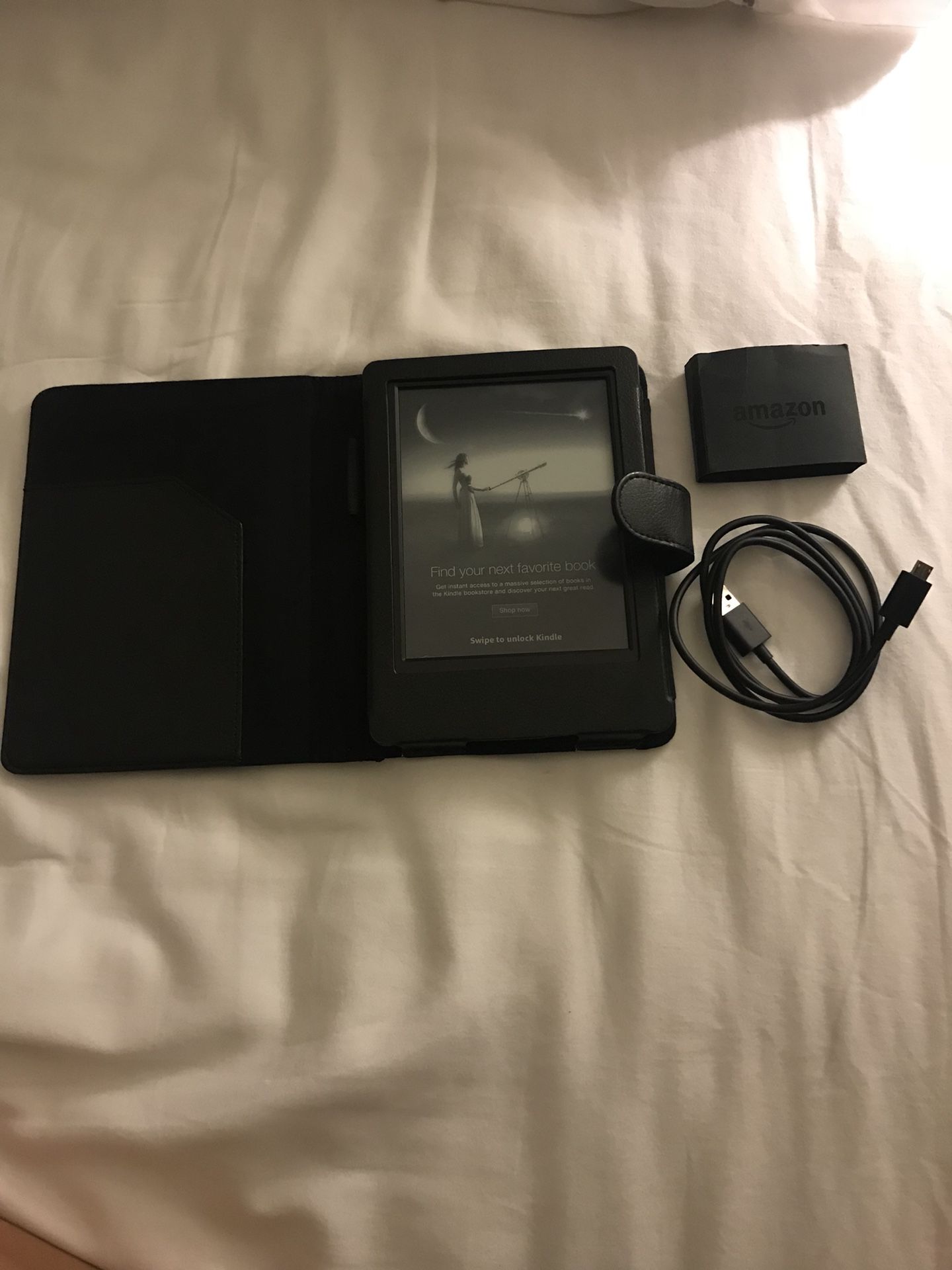 Barely used Kindle with leather case