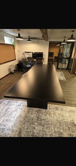 Black rectangular conference table 4’x14’