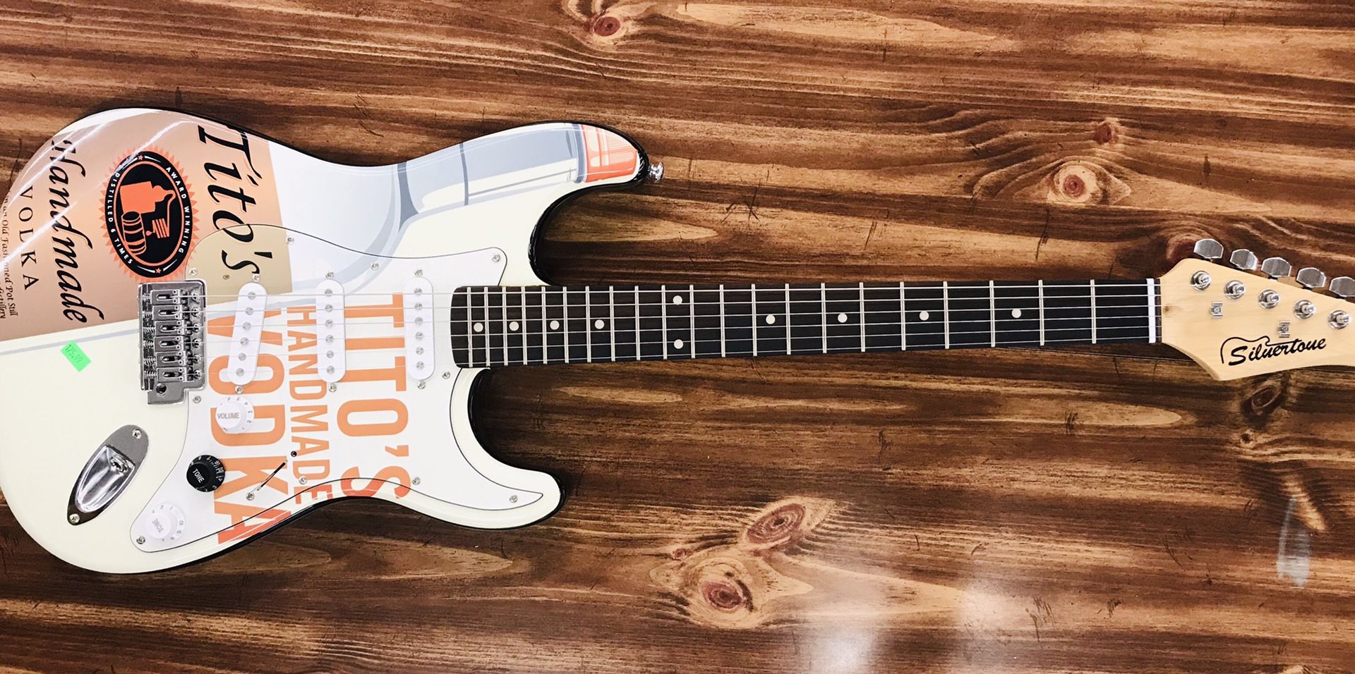 Silvertone Strat-Copy Official “Tito’s Handmade Vodka” Electric Guitar