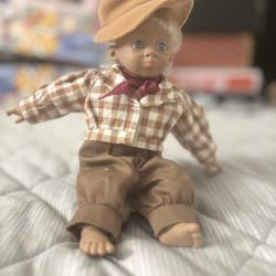 Vintage Western Cowboy Baby Doll – CollectibleSamanthaAnd she also has a hatPleaseHer name and she supposed to be holdingAnd she was also supposed to 