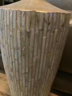 BEAUTIFUL 22” VASE WITH BLACK REEDS IN IT. IT IS BEAUTIFUL WHITE SHELL LIKE WITH GOLD. 