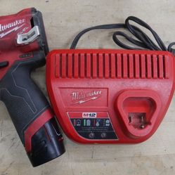   Milwaukee 2554-20 M12 FUEL Stubby 3/8" Impact Wrench Kit , battery 1.5 AH, 48-59-2401 . used. tested. in a good working order. 