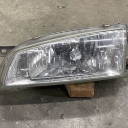 98-01 Subaru Impreza LH drivers clear glass headlight