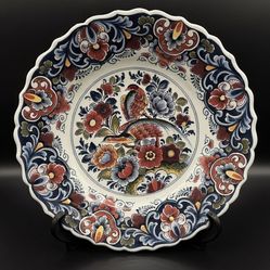 12” Delft Polychrome Charger Plate Featuring Bird, Flowers and Foliage. A hint of gentle crazing Consistent with Item’s age. 