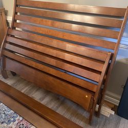 Sleigh bed frame with rails