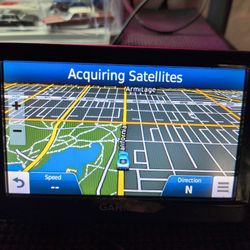 2 Garmin Auto GPS System. 